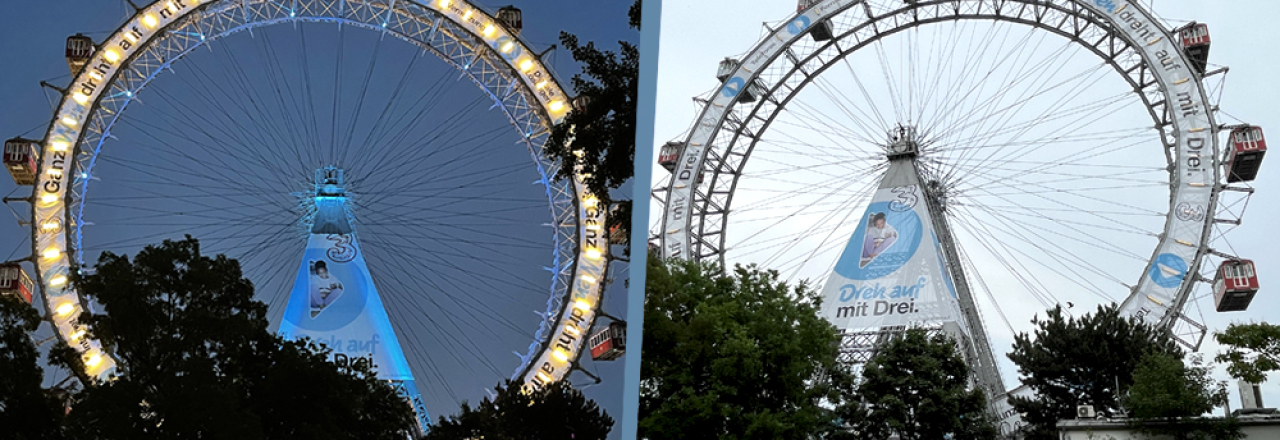 Die Werbehelden lassen das Riesenrad im Drei Österreich Branding erstrahlen